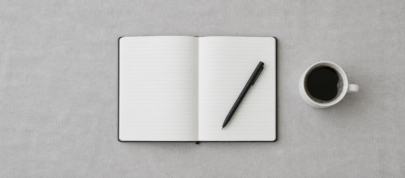 Open journal and pen for sharing stories